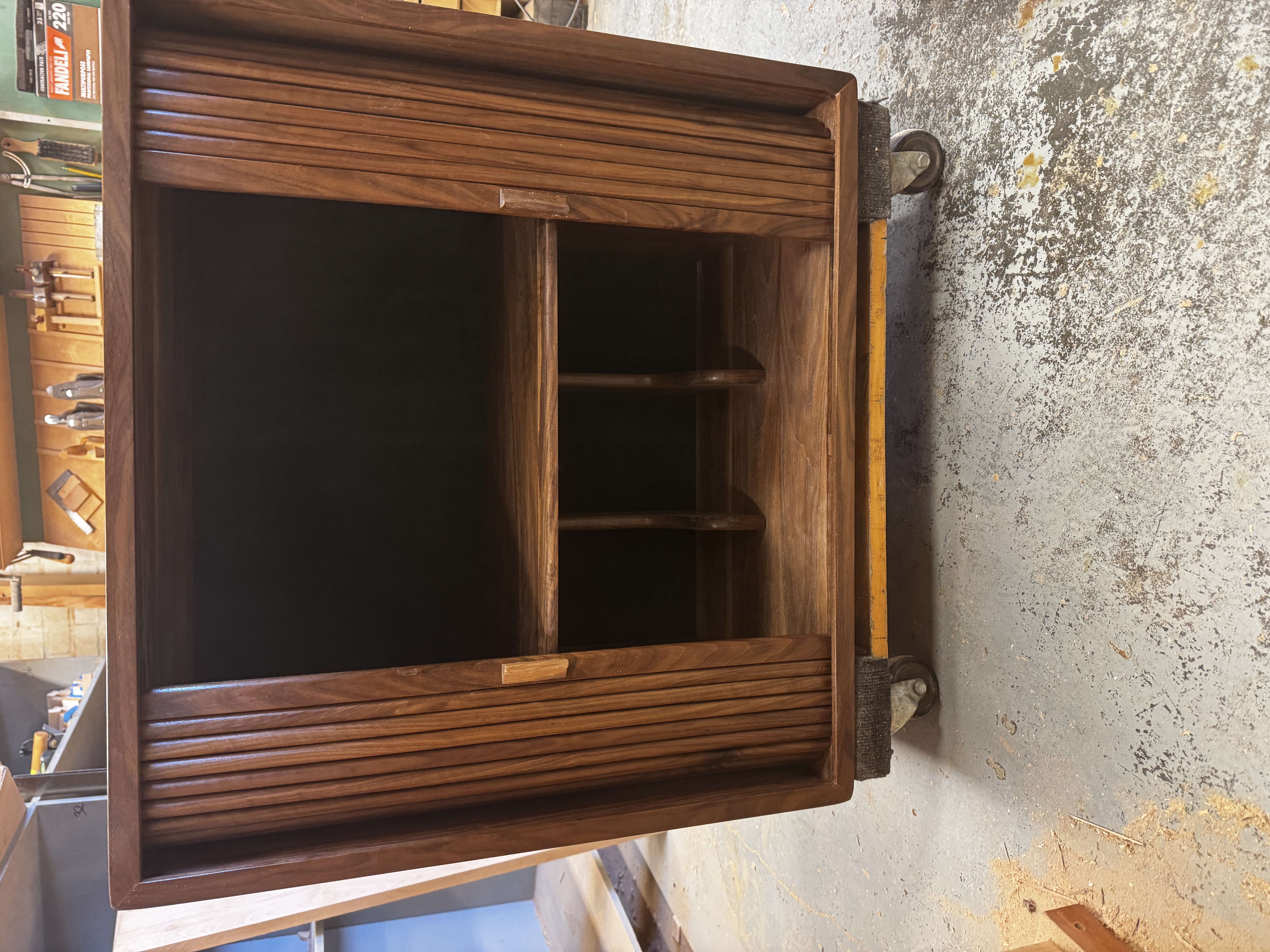 Record cabinet with doors open and lacquer finish applied.